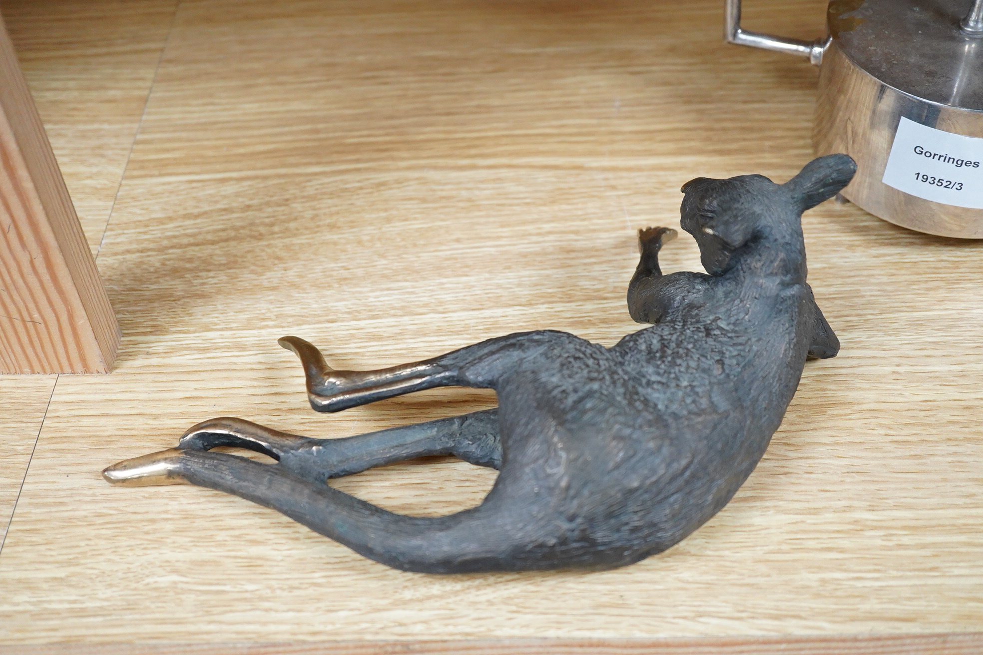 A late 20th century Australian partially gilt bronze model of a recumbent kangaroo, limited edition 5/50, 26cm wide